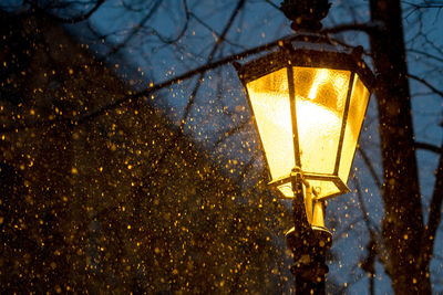 Low angle view of illuminated street lamp at night