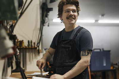 Blacksmith working in his workshop