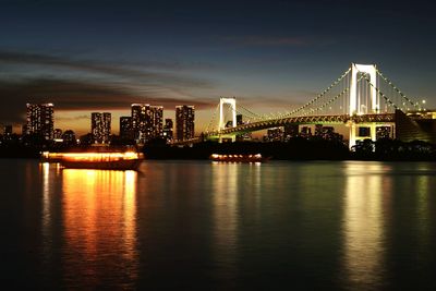 Illuminated city at waterfront