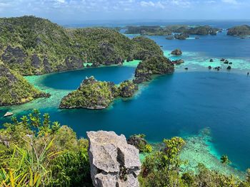 High angle view of puncak harapan against sky in misool island raja ampat indonesia 