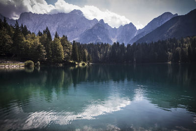 Scenic view of lake and mountains against sky