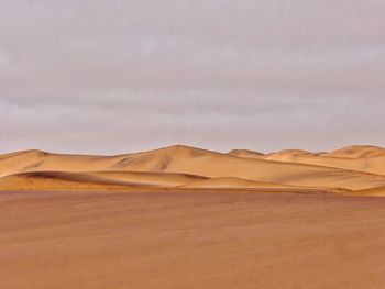 Scenic view of desert against sky