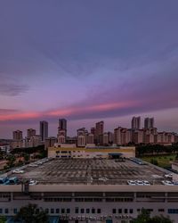 High angle view of buildings against sky during sunset