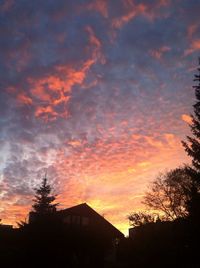 Low angle view of cloudy sky at sunset