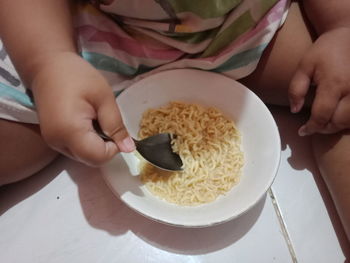 Midsection of woman holding food