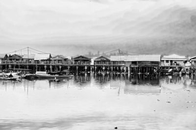 Calm sea with buildings in background