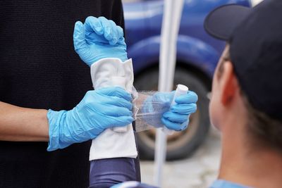Midsection of doctor giving medicine