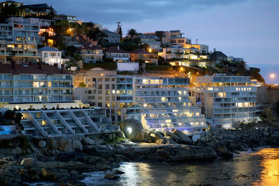 Buildings in city at night
