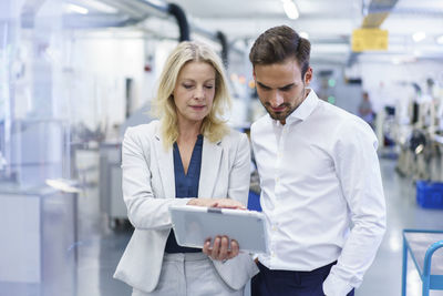 Full length of a man using mobile phone