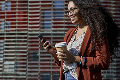 Woman holding coffee cup