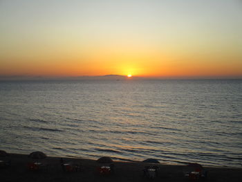 Scenic view of sea against clear sky during sunset