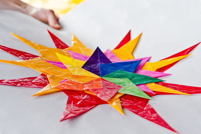 High angle view of multi colored pencils on paper