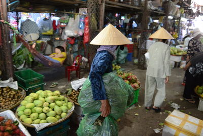 People at market stall