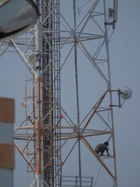 Man working on communications tower 