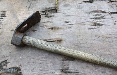 Close-up of hand tool on wooden table