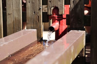 Close-up of red wooden door in building