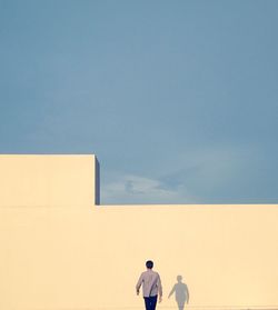 Woman standing against wall