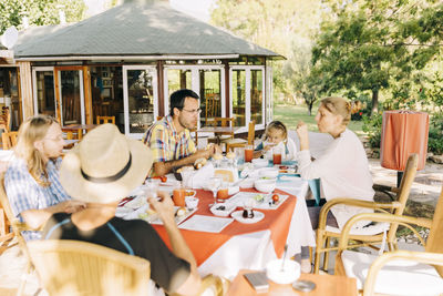 High angle view of people eating food outdoors