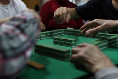 Midsection of man playing piano