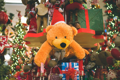 Close-up of stuffed toy hanging with christmas decoration