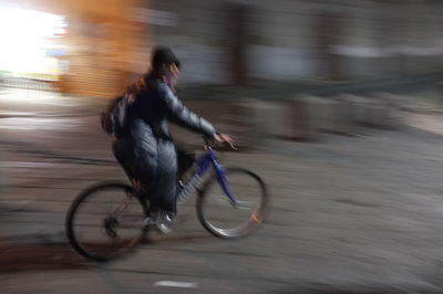 Blurred motion of people walking on road