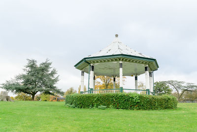 Gazebo on field against sky