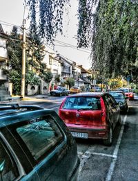 Car on city street against sky