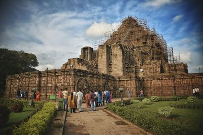 Low angle view of temple against cloudy sky