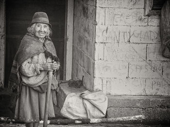 Statue of buddha against wall
