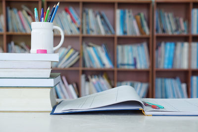 Close-up of books on table in library