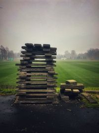 Stone stack on field against sky