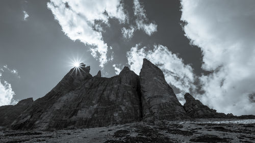 Low angle view of rock formations against sky