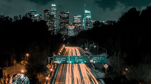 High angle view of city lit up at night