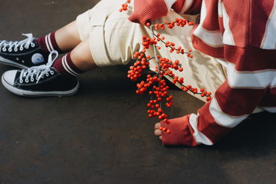 Low section of woman sitting on floor