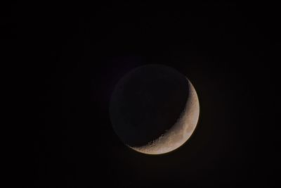 Low angle view of moon against sky at night