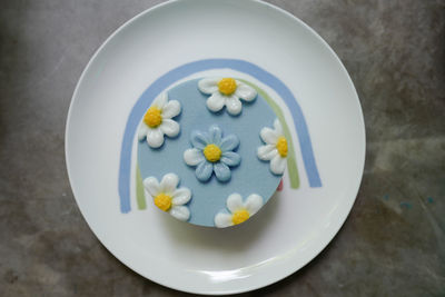 High angle view of white roses in plate on table