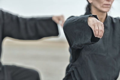 Midsection of man standing at home