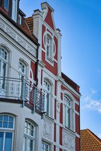 Low angle view of building against blue sky