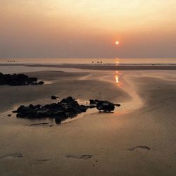 Scenic view of sea at sunset