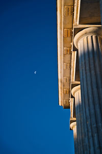 Low angle view of historic building against blue sky