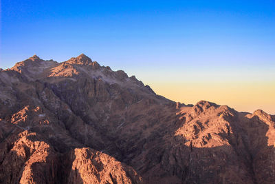 Scenic view of rocky mountains against clear sky