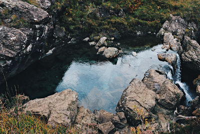 High angle view of rocks by river