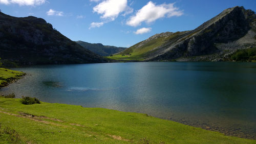 Scenic view of lake and mountains against sky