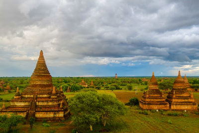 Ruins of temple against building