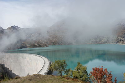 Scenic view of dam against mountain