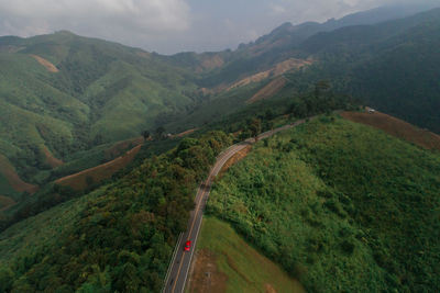 High angle view of road amidst mountains against sky