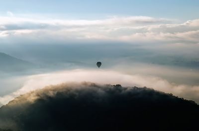 Low angle view of balloons against sky