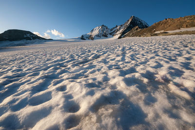 Scenic view of snow mountains against sky