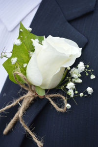 Close-up of white flower corsage