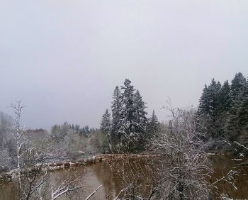 Scenic view of snow covered land against clear sky